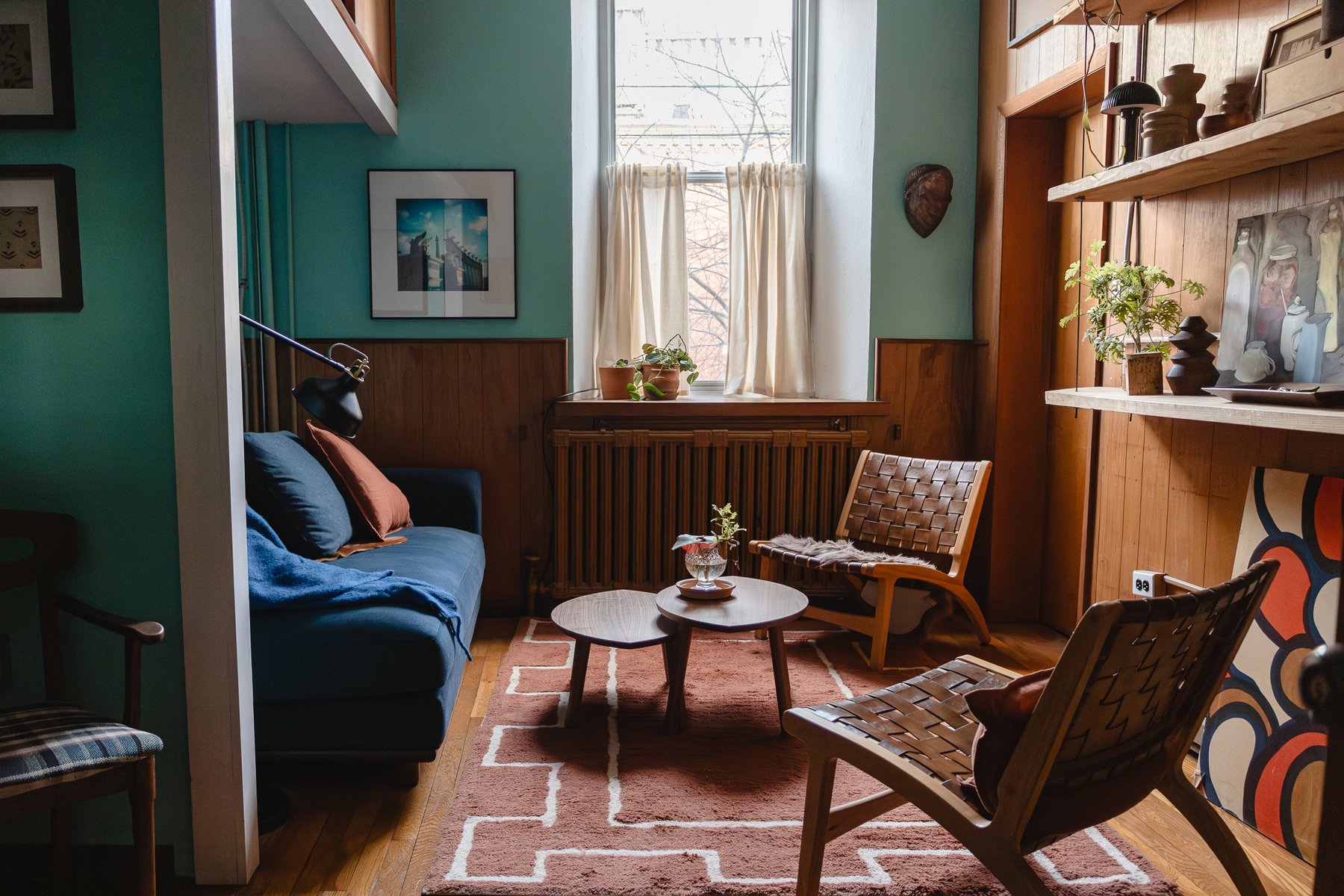 Centerline Therapy East Falls office — therapy room with blue sofa, soft natural light, and curated art